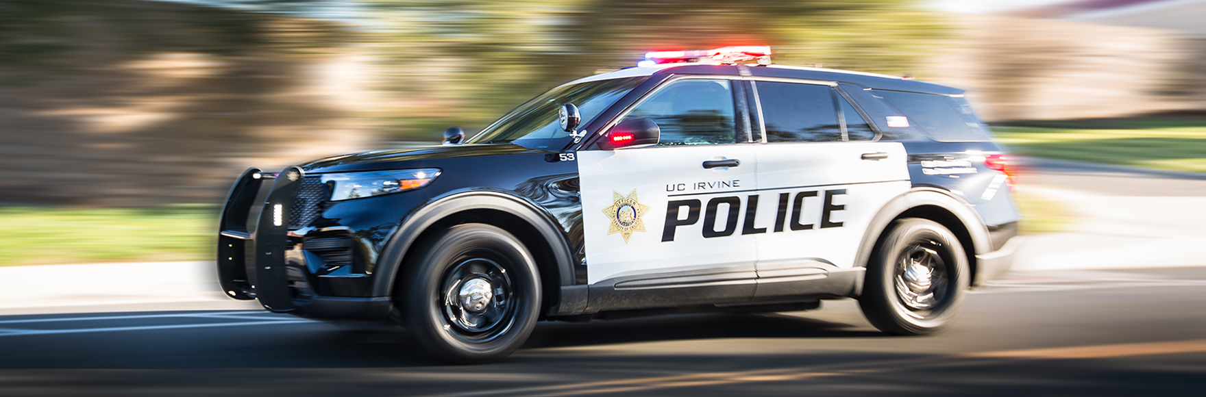 Police car zooming with lights and sirens