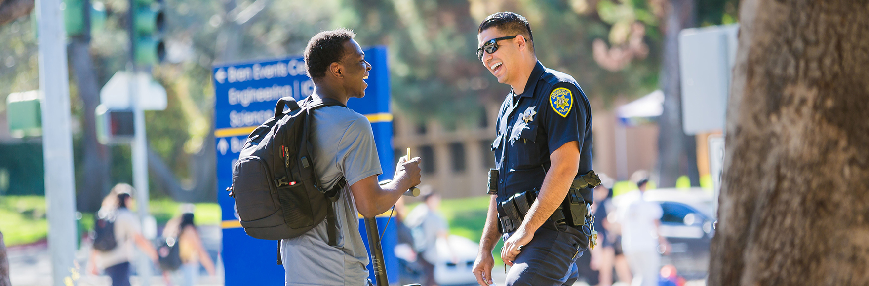 Officer showing a community member the patrol car